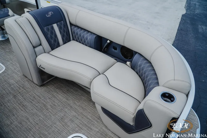 Slide: The Image of Luxurious seating on 2023 Barletta L550 boat with elegant upholstery and cup holder. - 14