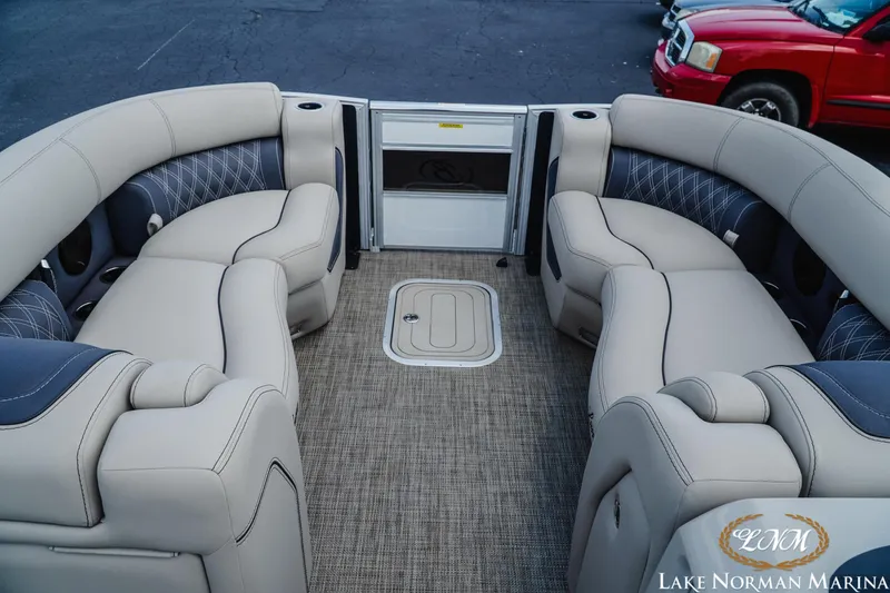 Slide: The Image of Luxurious interior of 2023 Barletta L550 pontoon boat with plush seating at Lake Norman Marina. - 11