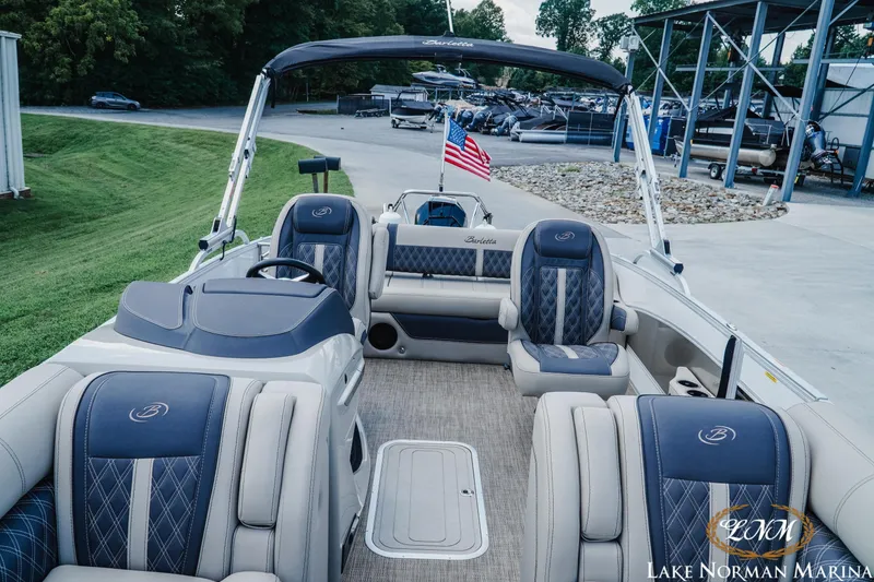 Slide: The Image of 2023 Barletta L550 pontoon boat interior with luxurious seating at Lake Norman Marina. - 12