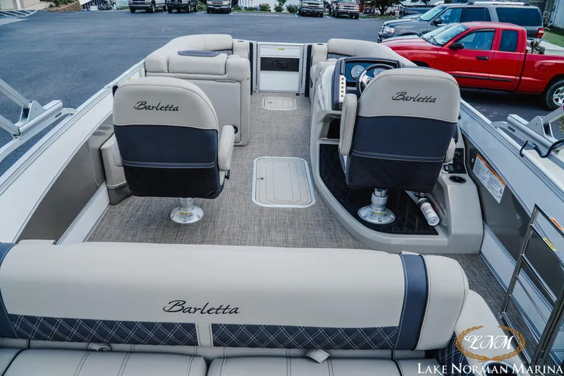 Slide: The Image of 2023 Barletta L550 pontoon boat interior with plush seating at Lake Norman Marina. - 5