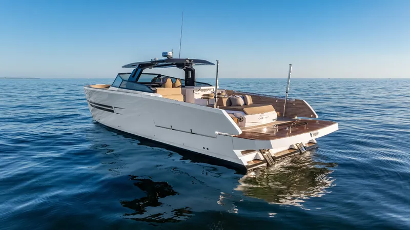 Slide: The Image of Luxury 2026 OKEAN 57 yacht cruising on open water under clear blue skies. - 25