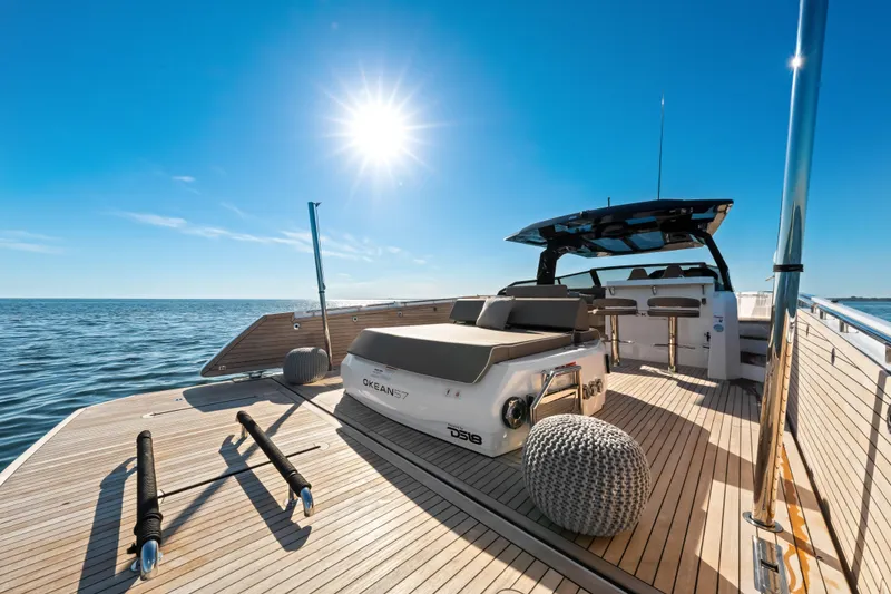 Slide: The Image of Luxurious 2026 OKEAN 57 yacht deck under bright sun, cruising on open sea. - 40