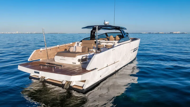 Slide: The Image of 2026 OKEAN 57 yacht cruising on calm blue waters under clear skies. - 38