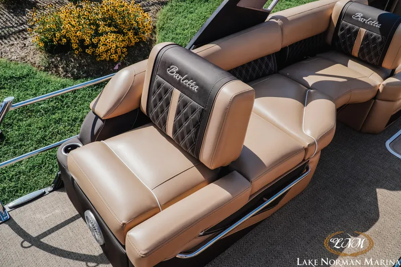 Slide: The Image of Luxurious seating on a 2025 Barletta L25MAT pontoon boat, featuring elegant tan and black upholstery. - 6