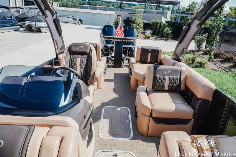 Slide: The Image of 2025 Barletta L25MAT pontoon boat interior with luxurious seating at Lake Norman Marina. - 16