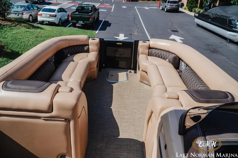 Slide: The Image of Luxurious 2025 Barletta L25MAT pontoon boat interior with plush seating at Lake Norman Marina. - 11
