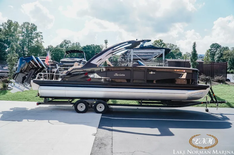 The Image of 2025 Barletta L25MAT pontoon boat on trailer at Lake Norman Marina. - 1