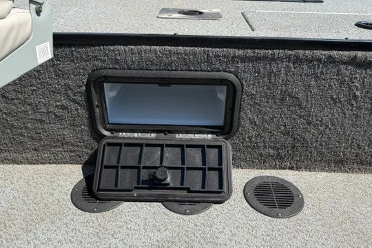 Slide: The Image of 2018 Ranger VS1670 SC boat storage compartment with open lid and organized interior. - 9