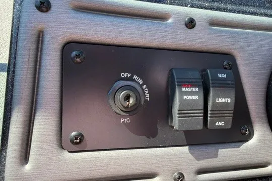 Slide: The Image of Control panel of a 2018 Ranger VS1670 SC boat with ignition and switches. - 16
