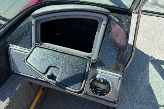 Slide: The Image of 2018 Ranger VS1670 SC boat dashboard with storage compartment and control panel. - 32