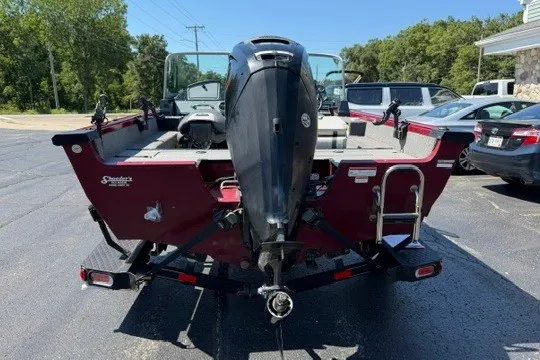 Slide: The Image of 2018 Ranger VS1670 SC boat, rear view, parked outdoors on a sunny day. - 4