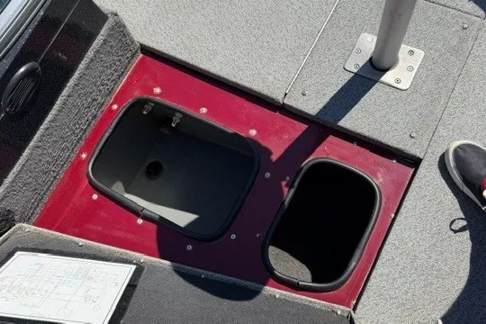 Slide: The Image of 2018 Ranger VS1670 SC boat storage compartments with open lids on deck. - 23