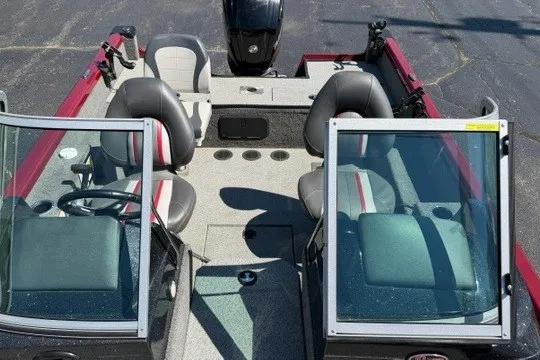 Slide: The Image of 2018 Ranger VS1670 SC boat interior with seating and steering wheel, featuring dual windshields. - 30