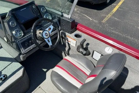 Slide: The Image of 2018 Ranger VS1670 SC boat interior with steering wheel and seat. - 12