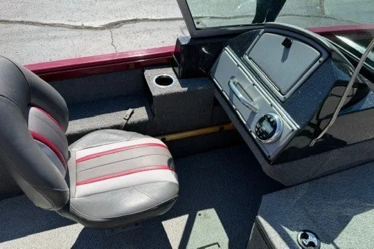 Slide: The Image of 2018 Ranger VS1670 SC boat interior with gray and red seating, dashboard, and cup holder. - 31