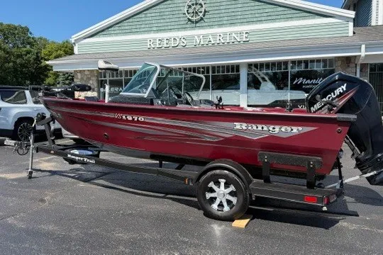 Slide: The Image of 2018 Ranger VS1670 SC boat in red, parked at Reed's Marine dealership. - 3