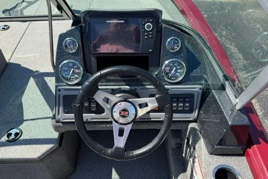 Slide: The Image of 2018 Ranger VS1670 SC boat dashboard with steering wheel and electronic display. - 13