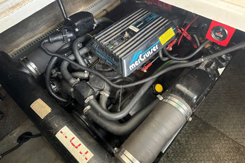 Slide: The Image of Engine compartment of a 1994 Regal Commodore 400 with MerCruiser components. - 39