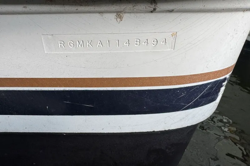 Slide: The Image of 1994 Regal Commodore 400 boat hull with identification number RGMKA114B494. - 45