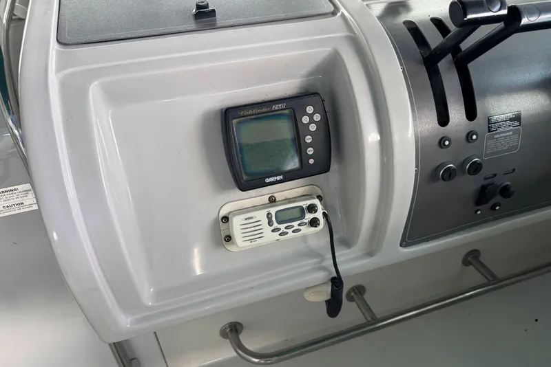 Slide: The Image of Control panel of a 1994 Regal Commodore 400 boat with Garmin fishfinder. - 19