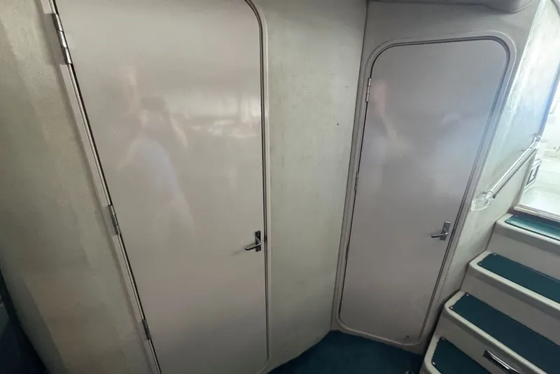 Slide: The Image of Interior of a 1994 Regal Commodore 400 yacht with doors and stairs. - 32