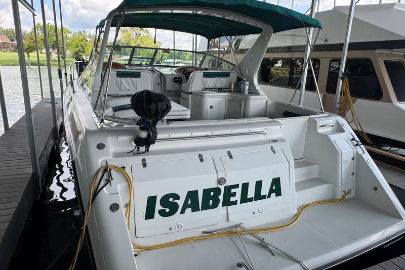 Slide: The Image of 1994 Regal Commodore 400 boat named "Isabella" docked at a marina. - 5