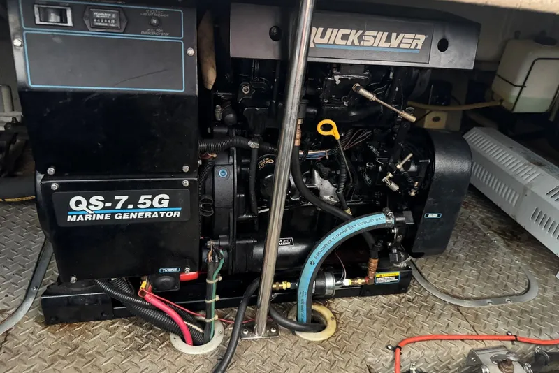 Slide: The Image of Marine generator QS-7.5G in a 1994 Regal Commodore 400 boat engine room. - 43