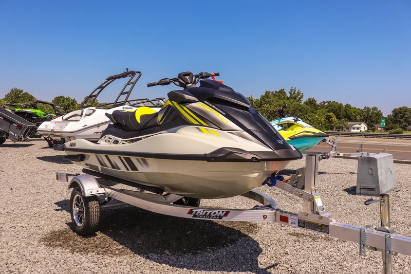 The Image of 2025 Yamaha WaveRunner GP HO on trailer, parked outdoors under clear blue sky. - 1
