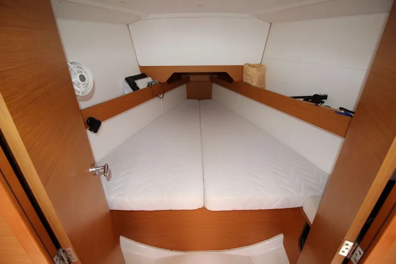 Slide: The Image of Interior cabin of 2015 Jeanneau Sun Odyssey 349 sailboat with white bedding. - 25
