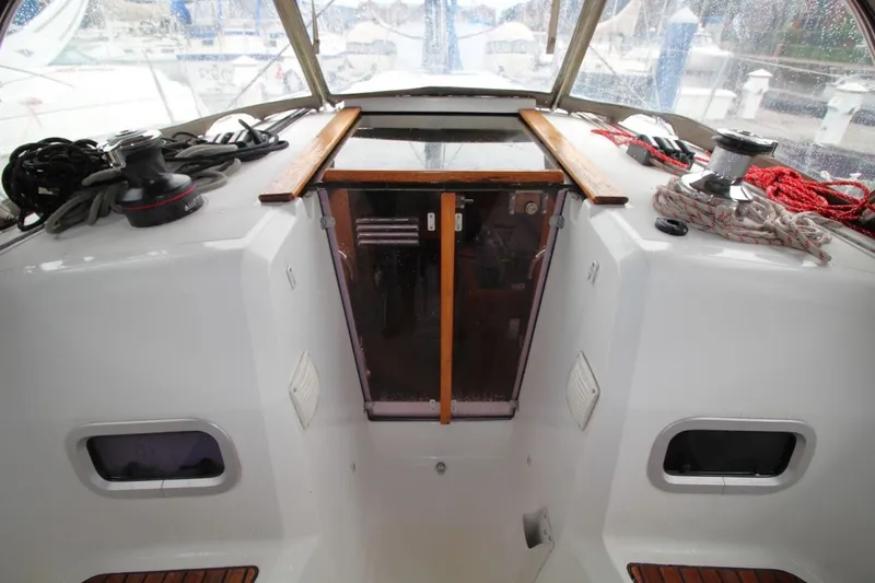 Slide: The Image of Cockpit view of 2015 Jeanneau Sun Odyssey 349 sailboat with ropes and winches. - 20