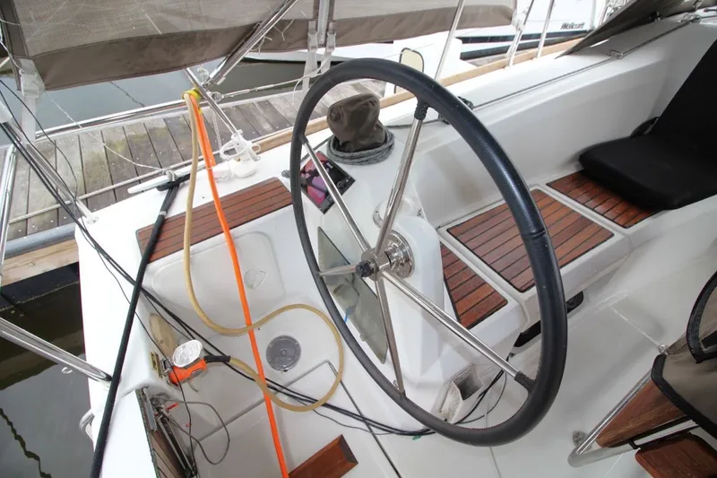 Slide: The Image of Cockpit of 2015 Jeanneau Sun Odyssey 349 sailboat with steering wheel and teak accents. - 18