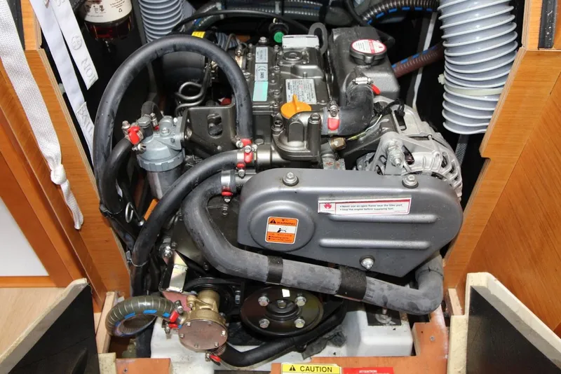 Slide: The Image of Engine compartment of a 2015 Jeanneau Sun Odyssey 349 sailboat, showcasing mechanical components. - 30