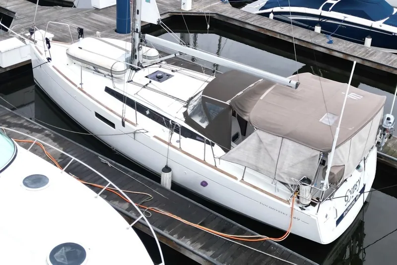 Slide: The Image of 2015 Jeanneau Sun Odyssey 349 sailboat docked at marina, aerial view. - 10