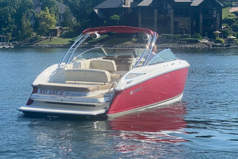 Slide: The Image of Red 2010 Cobalt 302 boat on a lake, near waterfront homes. - 8