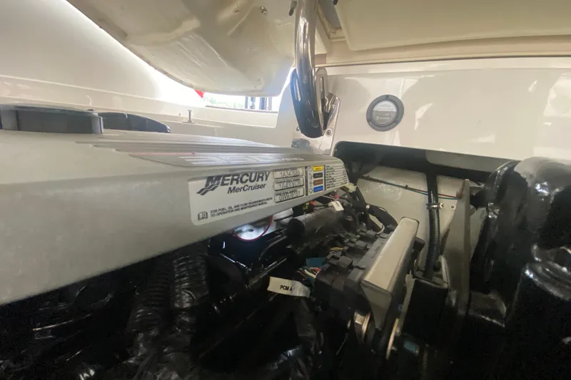 Slide: The Image of Engine compartment of a 2010 Cobalt 302 boat featuring a Mercury MerCruiser engine. - 43