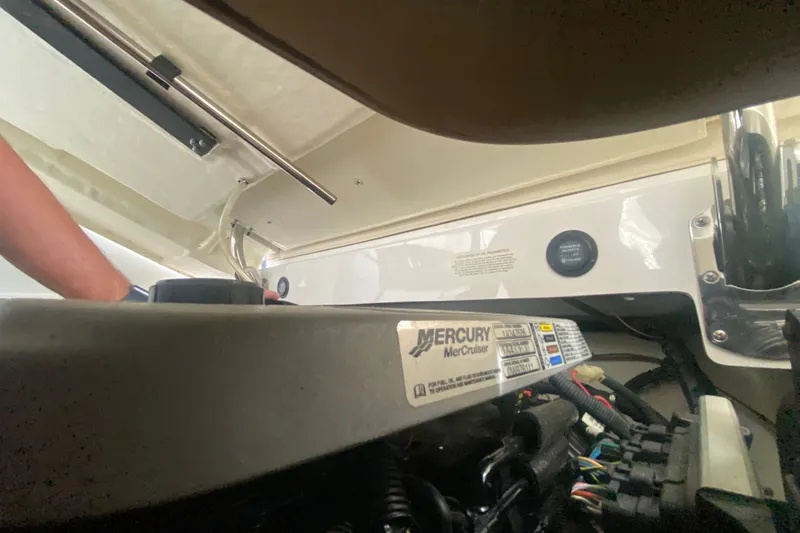Slide: The Image of Engine compartment of a 2010 Cobalt 302 boat with Mercury MerCruiser components. - 21