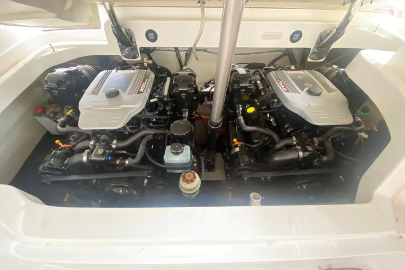 Slide: The Image of Twin engines in a 2010 Cobalt 302 boat engine compartment. - 41