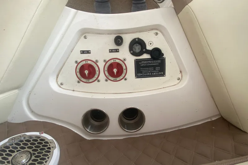 Slide: The Image of Control panel of a 2010 Cobalt 302 boat with battery switches and gauges. - 39
