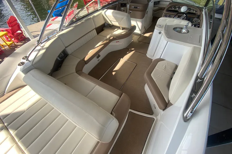 Slide: The Image of Luxurious interior of 2010 Cobalt 302 boat with plush seating and sleek design. - 13