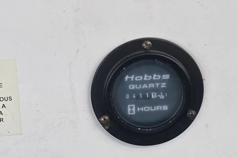 Slide: The Image of Hobbs Quartz hour meter on 2010 Cobalt 302, displaying 4111.1 hours. - 45