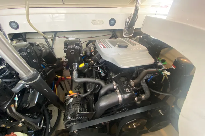 Slide: The Image of Engine compartment of a 2010 Cobalt 302 boat, showcasing detailed mechanical components. - 44
