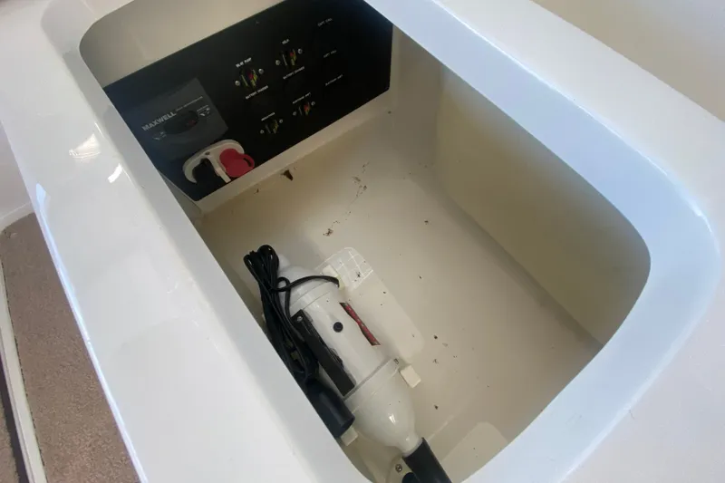 Slide: The Image of Storage compartment with control panel in 2010 Cobalt 302 boat. - 24