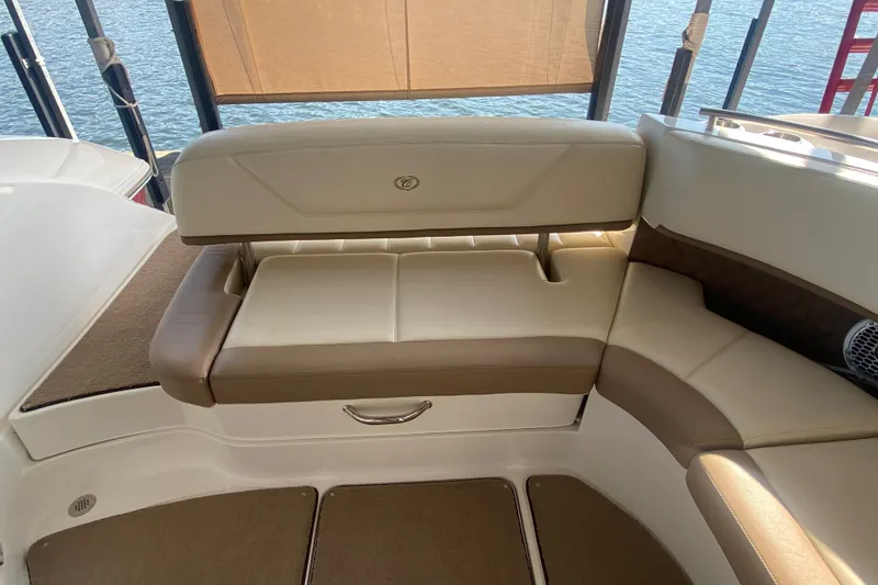Slide: The Image of Luxurious seating on a 2010 Cobalt 302 boat with beige and brown upholstery. - 22