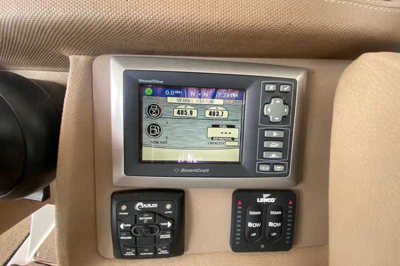 Slide: The Image of Dashboard of a 2010 Cobalt 302 boat with digital display and controls. - 30