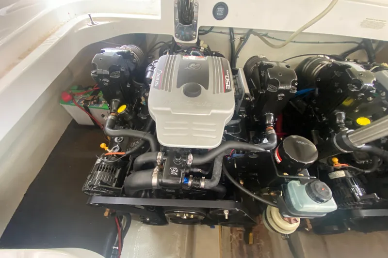 Slide: The Image of Engine compartment of a 2010 Cobalt 302 boat, featuring a powerful 350 MAG engine. - 42