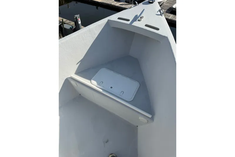 Slide: The Image of 2016 Allied 15 Sportsman boat interior with storage compartment, dockside view. - 7