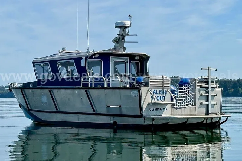 Slide: The Image of 2019 Armstrong Marine 38 Monohull boat on calm water, labeled "Salish Scout," Olympia, WA. - 2