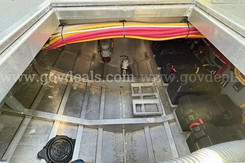 Slide: The Image of Engine compartment of a 2019 Armstrong Marine 38 Monohull with visible wiring and components. - 49