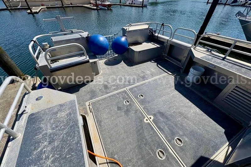 Slide: The Image of 2019 Armstrong Marine 38 Monohull boat deck with storage compartments and safety railings. - 10
