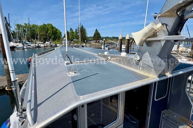 Slide: The Image of Armstrong Marine 38 Monohull boat, 2019 model, docked at a marina under clear skies. - 20